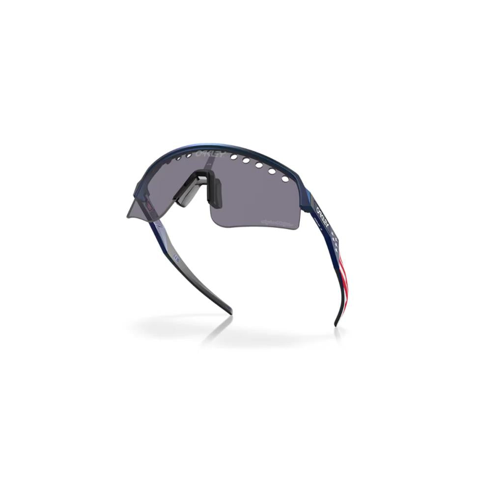 Oakley Sutro Lite Sweep Güneş Gözlüğü 946528 Amerikan Bayraklı TLD Blue ColorShift Prizm Grey